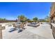 Spacious backyard patio with seating and a relaxing hot tub, perfect for outdoor entertaining at 9347 E Hillview Cir, Mesa, AZ 85207