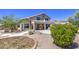 Large backyard with attractive landscaping, manicured bushes and pool in background at 9347 E Hillview Cir, Mesa, AZ 85207