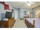 Bright bedroom with a ceiling fan, carpeted floors, and a closet door, ready for personalization at 9347 E Hillview Cir, Mesa, AZ 85207