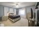 Inviting bedroom with a ceiling fan, soft carpet, and neutral paint creates a relaxing atmosphere at 9347 E Hillview Cir, Mesa, AZ 85207