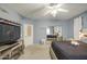 Cozy bedroom featuring plush carpet, ample space, and a mirror closet door for storage at 9347 E Hillview Cir, Mesa, AZ 85207