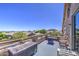 Expansive deck with outdoor seating, offering scenic views of the neighborhood and mountains at 9347 E Hillview Cir, Mesa, AZ 85207