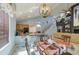 Open kitchen with granite counters, oak cabinets and dining area and staircase to upper level at 9347 E Hillview Cir, Mesa, AZ 85207