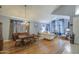 Formal living and dining room with hardwood floors, elegant decor, and natural light at 9347 E Hillview Cir, Mesa, AZ 85207