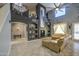 A spacious living room with vaulted ceilings, neutral colors, and an entertainment center at 9347 E Hillview Cir, Mesa, AZ 85207