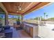 Inviting outdoor kitchen with a built-in grill and ample counter space for cooking and entertaining at 9347 E Hillview Cir, Mesa, AZ 85207