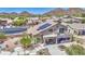 The home has a covered patio, a balcony, desert landscaping, a pool, and a spa at 9347 E Hillview Cir, Mesa, AZ 85207