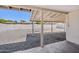 Open backyard area features a gravel ground covering and a covered patio at 1017 S Allen --, Mesa, AZ 85204