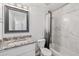 Bathroom featuring an updated vanity, tub with marble tile and modern finishes at 1017 S Allen --, Mesa, AZ 85204