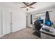 Bedroom with ceiling fan, neutral carpet, and a large desk ideal for a home office at 1017 S Allen --, Mesa, AZ 85204