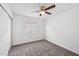 Cozy bedroom with plush carpet, a window, and a closet space, ready for personalization at 1017 S Allen --, Mesa, AZ 85204
