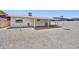 Back exterior of the house featuring a covered patio and gravel yard at 1017 S Allen --, Mesa, AZ 85204