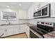 Updated kitchen showcasing stainless steel appliances, white subway tile backsplash, granite counters, and ample storage at 1017 S Allen --, Mesa, AZ 85204