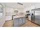Beautiful kitchen featuring stainless steel appliances, granite countertops, and a central island with pendant lights at 1017 S Allen --, Mesa, AZ 85204