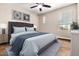 Comfortable bedroom with a large bed and carpet flooring at 10221 E Wavelength Ave, Mesa, AZ 85212