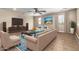 Bright living room with large windows, stylish furniture, and decorative accents at 10221 E Wavelength Ave, Mesa, AZ 85212