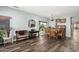 Traditional dining room with hardwood floors, elegant chandelier, and plenty of natural light at 10359 E Jacob Ave, Mesa, AZ 85209