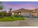 Lovely single-story home featuring manicured lawn, desert landscaping, and covered porch at 10359 E Jacob Ave, Mesa, AZ 85209