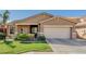 Charming single-story home with desert landscaping, two-car garage, and neutral stucco exterior at 10359 E Jacob Ave, Mesa, AZ 85209