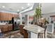 Open kitchen with stainless steel appliances, granite countertops, and bright breakfast nook at 10359 E Jacob Ave, Mesa, AZ 85209