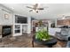 Inviting living space with fireplace, comfortable seating, and open flow to kitchen and dining at 10359 E Jacob Ave, Mesa, AZ 85209