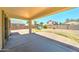 View of back patio with block wall, houses, and playground set in the background at 10524 W Pima St, Tolleson, AZ 85353