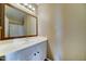 Bathroom features white vanity with a framed mirror and modern lighting at 10524 W Pima St, Tolleson, AZ 85353