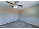 Bedroom with neutral carpet and fan at 10524 W Pima St, Tolleson, AZ 85353