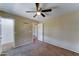 Bedroom with neutral carpet and fan at 10524 W Pima St, Tolleson, AZ 85353