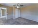 Bedroom features ceiling fan, closet, and neutral carpet at 10524 W Pima St, Tolleson, AZ 85353