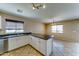Bright kitchen with white cabinets, an island, and tiled floors at 10524 W Pima St, Tolleson, AZ 85353