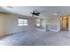 Carpeted loft with window providing natural light, white railings, and light fixtures at 10524 W Pima St, Tolleson, AZ 85353