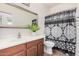 This full bathroom has a modern sink and shower with stylish curtain at 11826 W Villa Hermosa Ln, Sun City, AZ 85373