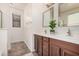 Elegant bathroom showcasing double sinks, modern fixtures, and vanity with storage at 11826 W Villa Hermosa Ln, Sun City, AZ 85373