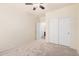 The carpeted bedroom features a closet and is freshly painted in neutral colors at 11826 W Villa Hermosa Ln, Sun City, AZ 85373