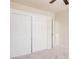 Carpeted bedroom features a double door closet and is freshly painted at 11826 W Villa Hermosa Ln, Sun City, AZ 85373