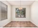Dining room featuring tile floors, a decorative light fixture and natural light at 11826 W Villa Hermosa Ln, Sun City, AZ 85373