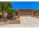 Charming single-Gathering home with a desert landscape and a two-car garage at 11826 W Villa Hermosa Ln, Sun City, AZ 85373