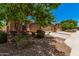 Charming single-Gathering home with a desert landscape and a two-car garage at 11826 W Villa Hermosa Ln, Sun City, AZ 85373