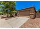 Charming single-Gathering home with a desert landscape and a two-car garage at 11826 W Villa Hermosa Ln, Sun City, AZ 85373