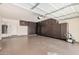 A large garage features a wall of cabinets for storage and an epoxy floor at 11826 W Villa Hermosa Ln, Sun City, AZ 85373