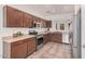 Modern kitchen featuring stainless steel appliances and wood cabinets with plenty of counter space at 11826 W Villa Hermosa Ln, Sun City, AZ 85373