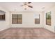 Bright and spacious living room featuring tile flooring and natural light at 11826 W Villa Hermosa Ln, Sun City, AZ 85373