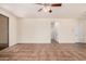 Spacious living room with tile floors and neutral paint throughout at 11826 W Villa Hermosa Ln, Sun City, AZ 85373