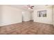 Bright living room featuring tile floors and neutral paint throughout at 11826 W Villa Hermosa Ln, Sun City, AZ 85373