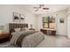 Serene main bedroom with a plush bed, neutral tones, and a window view of the outdoors at 11826 W Villa Hermosa Ln, Sun City, AZ 85373