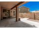 Covered patio with sliding glass door and neutral colors providing an excellent space for outdoor relaxation and entertainment at 11826 W Villa Hermosa Ln, Sun City, AZ 85373