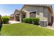 Backyard featuring low-maintenance artificial turf and an inviting covered patio space at 12109 W Tether Trl, Peoria, AZ 85383