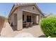 Backyard view with a covered patio and outdoor dining area, ideal for enjoying outdoor living at 12109 W Tether Trl, Peoria, AZ 85383