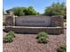 Stone community sign that reads 'Coldwater Ranch' set amongst green landscaping and decorative rock at 12109 W Tether Trl, Peoria, AZ 85383
